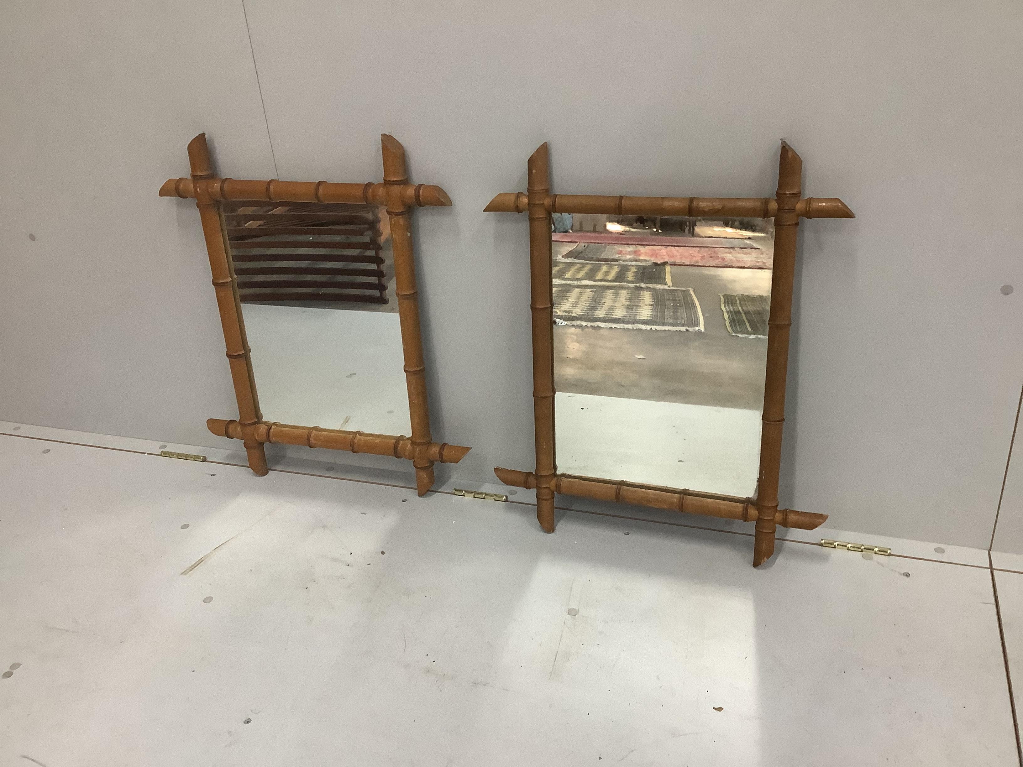 A pair of early 20th century simulated bamboo frame wall mirrors, width 68cm, height 56cm